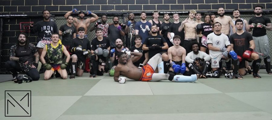 A large group of Motiv members and coaches on the mats after training